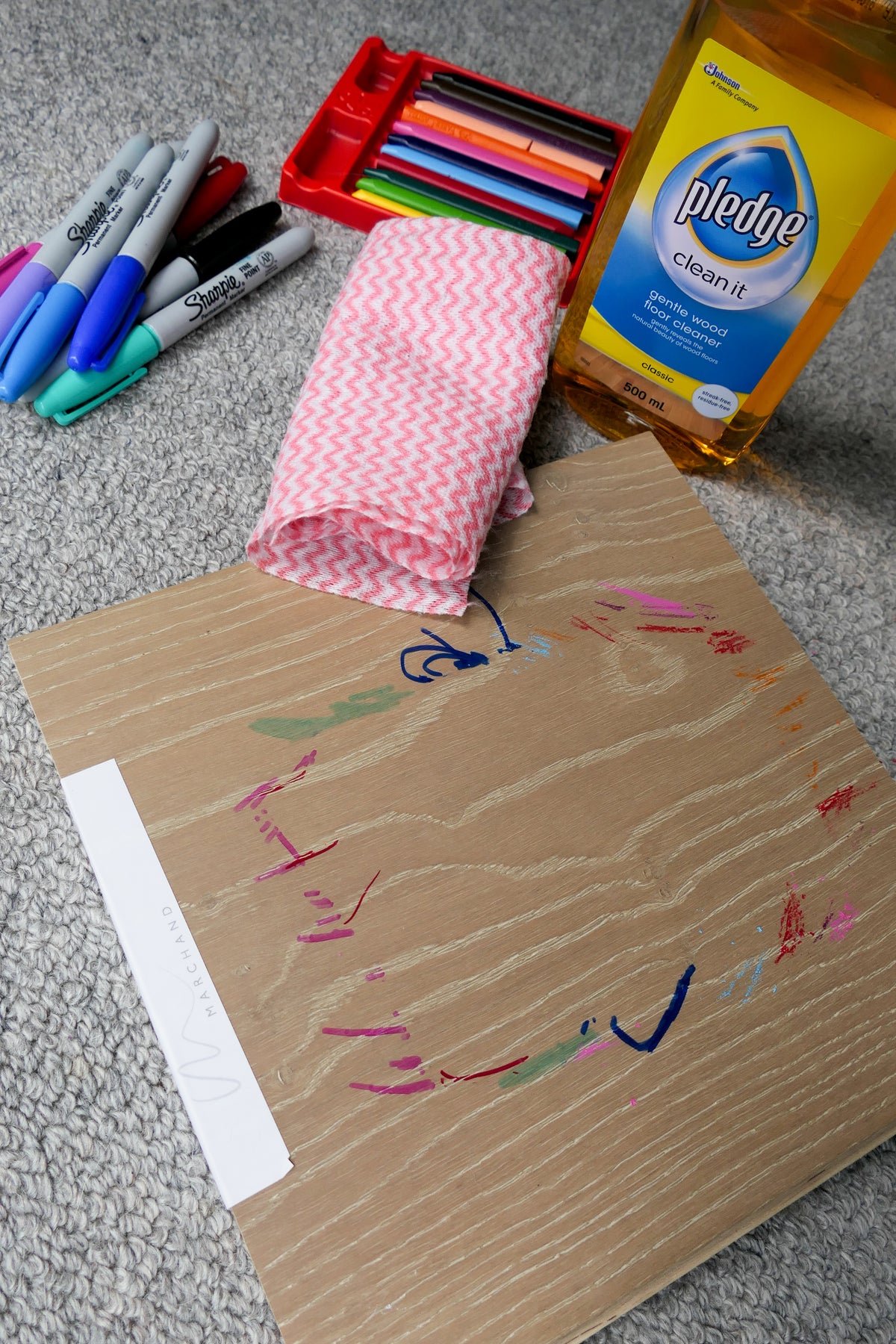 Marchand Test Lab: Vivid marker and crayon marks on a brushed La Forêt Oak board, with Pledge wood floor cleaner and a cloth