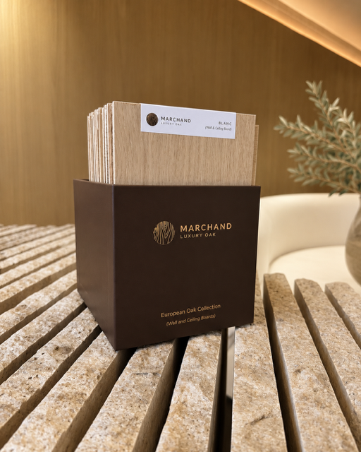 Marchand designer sample box holding the European oak wall and ceiling board collection, shown against oak wall boards