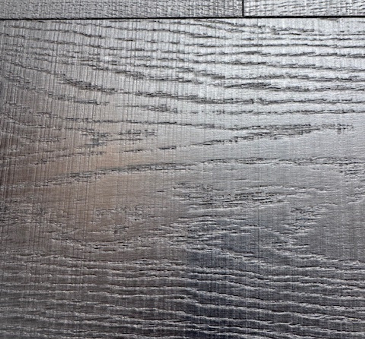 Noir Bandsawn swatch, a dark European oak with a sawn texture