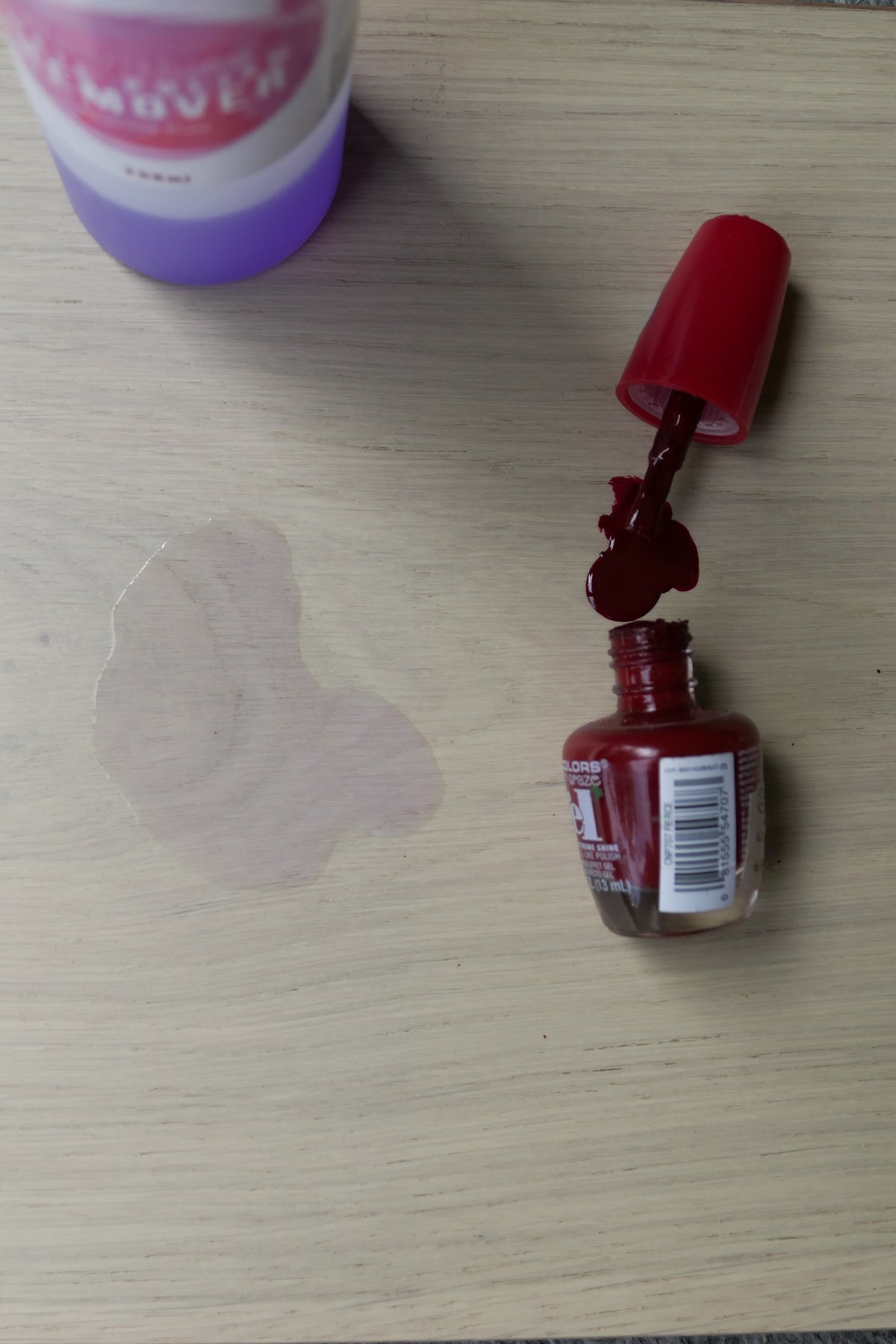 Marchand Test Lab: red nail polish and nail polish remover spilt on a Blanc Oak flooring board