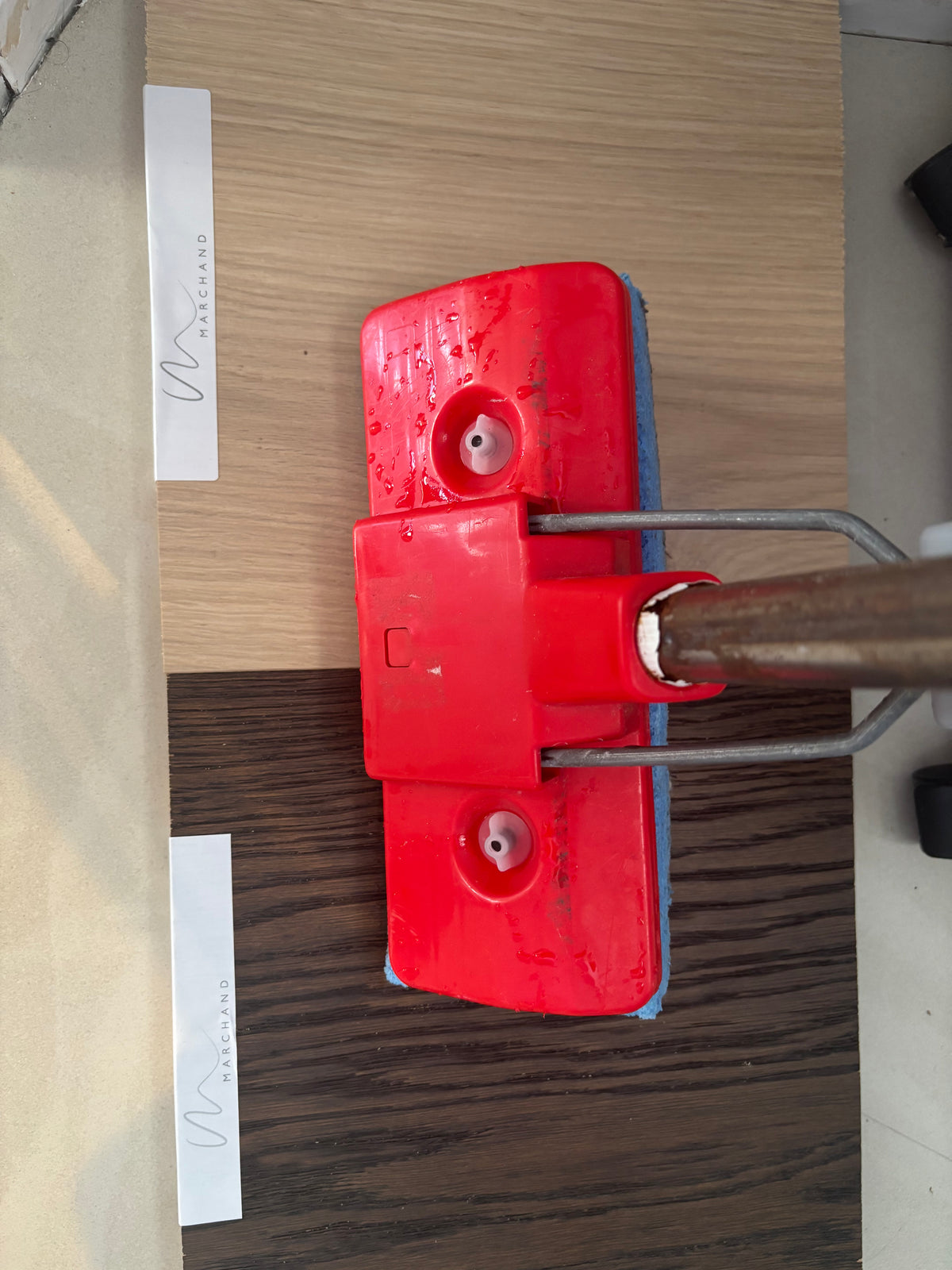 Marchand Test Lab: a wet sponge mop stood across Blanc Oak and Chocolat Oak flooring boards at the start of a three-day water test